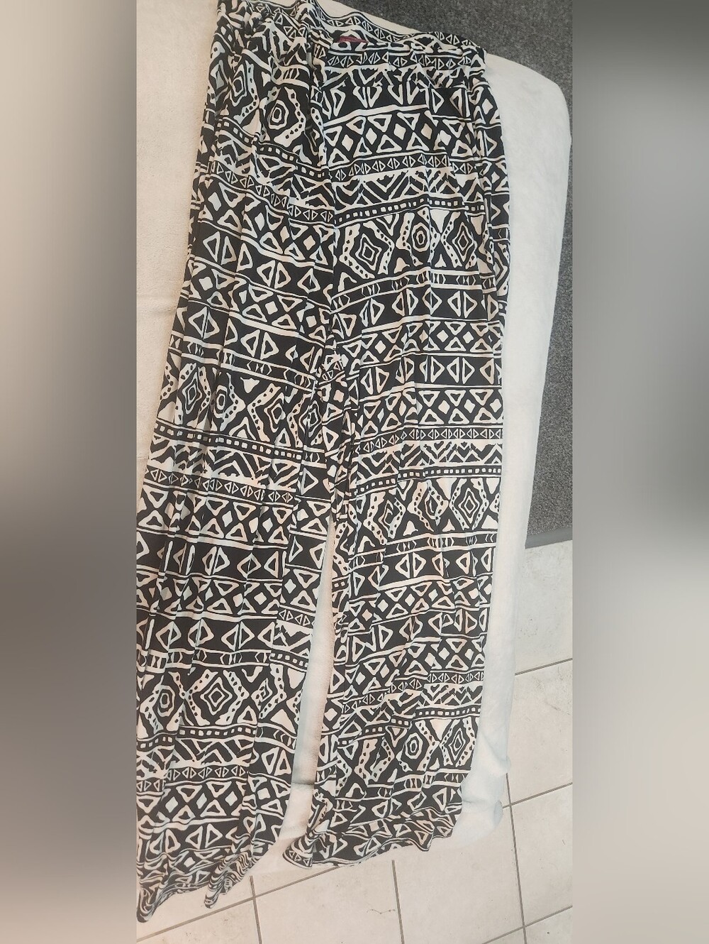 Pinc Black & White Tribal Print Garment with Pink Logo